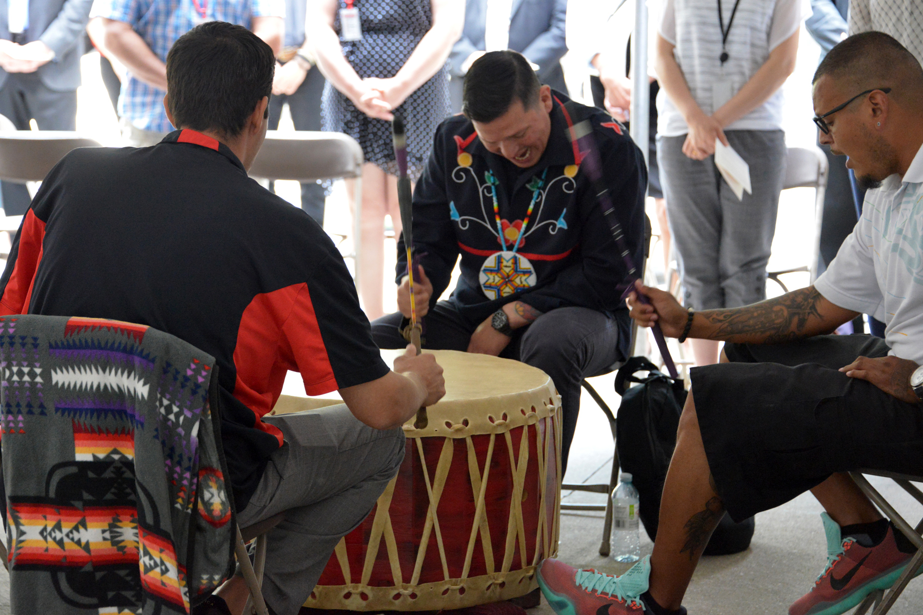 Photo of Indigenous men playing drums