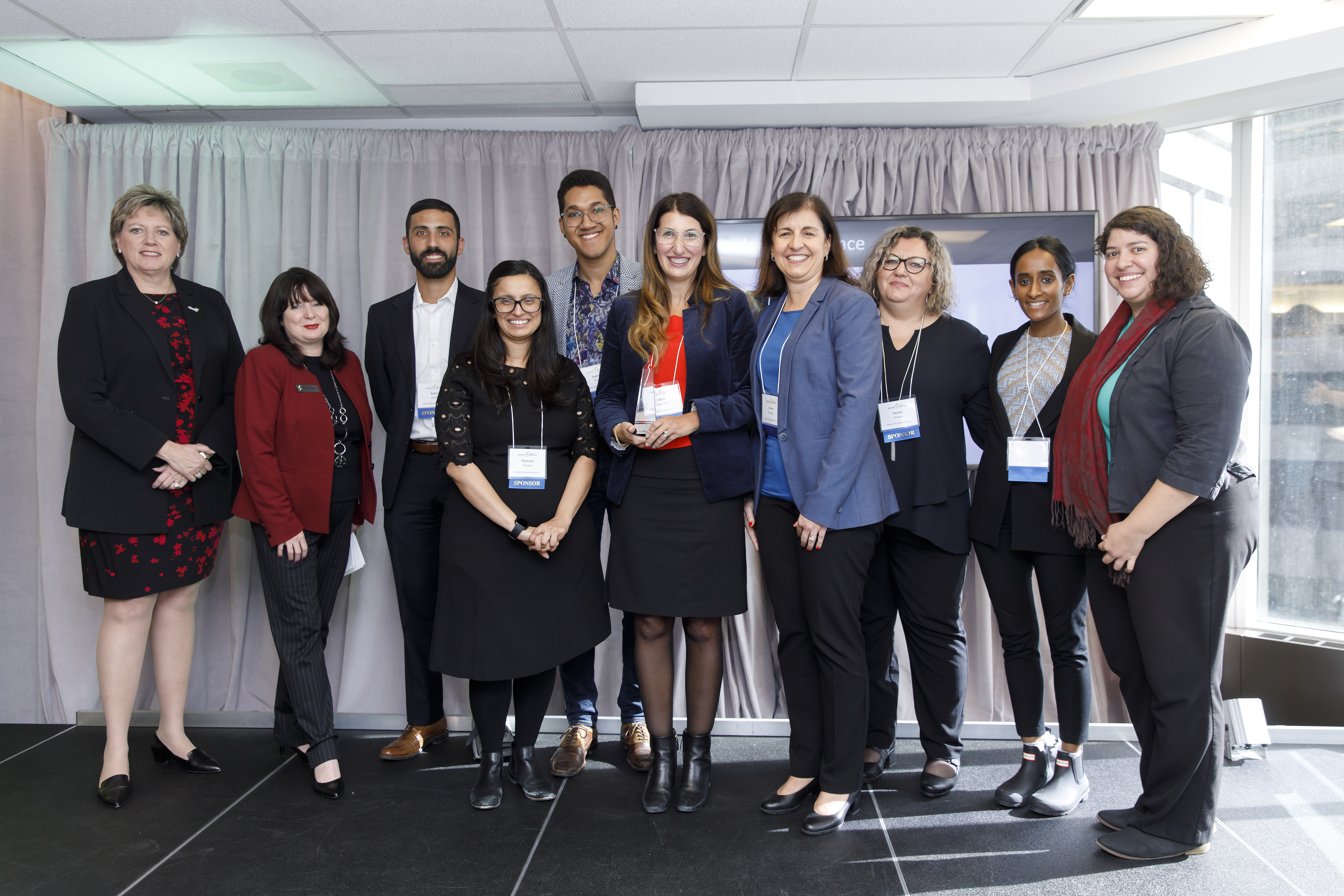 Photo of a diverse group of Hydro One employees at a conference