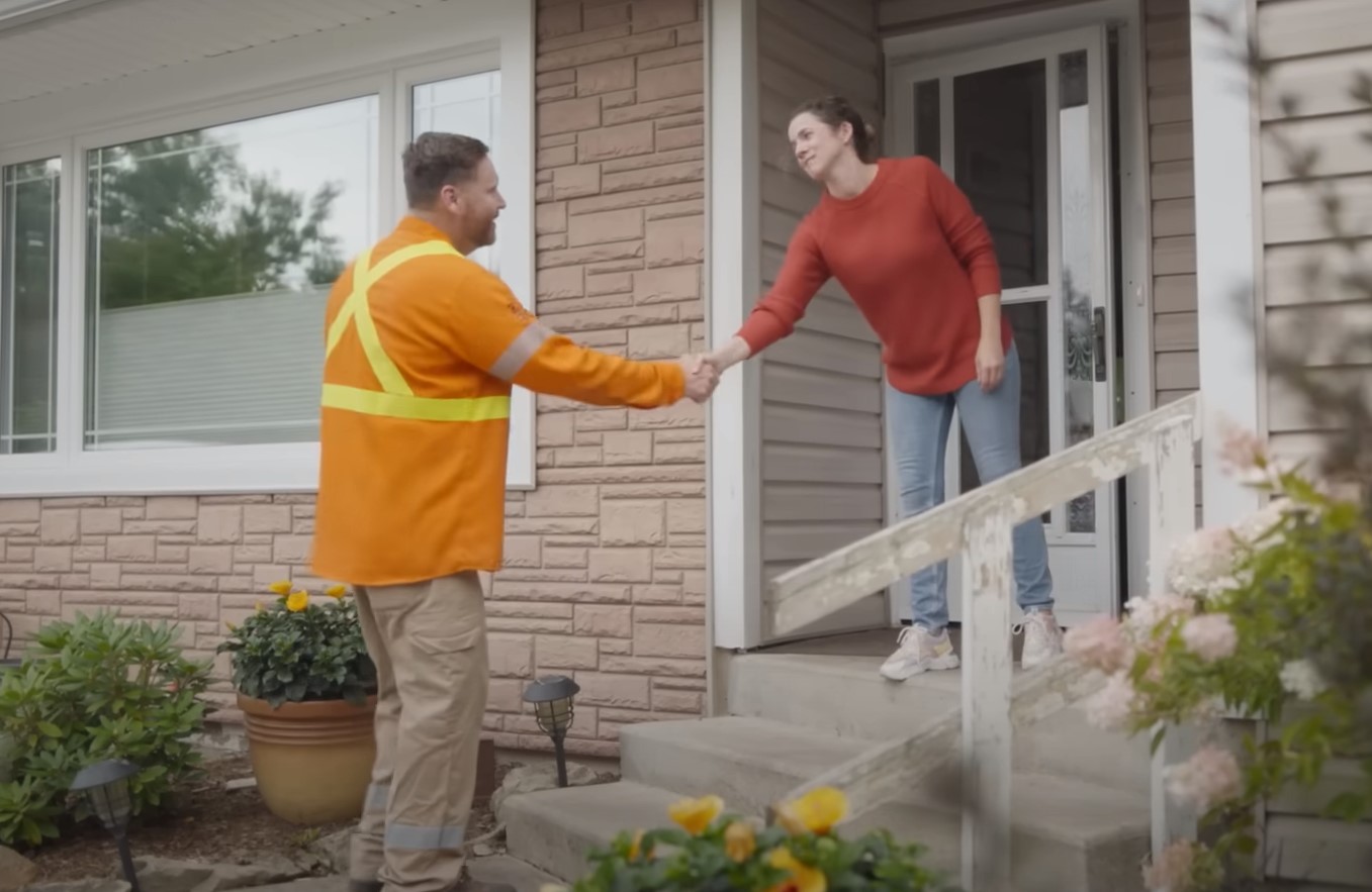 two people shaking hands smiling