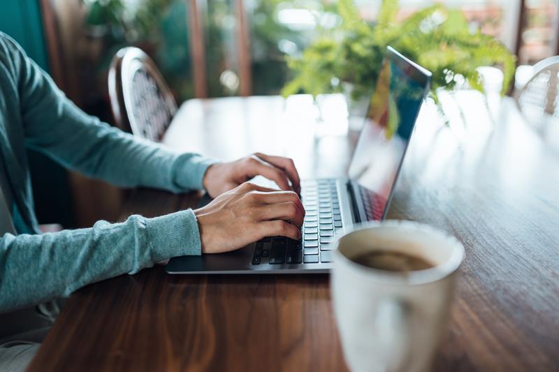 photo of a person using a laptop computer