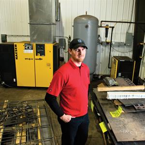 Image of a man standing in a commercial warehouse