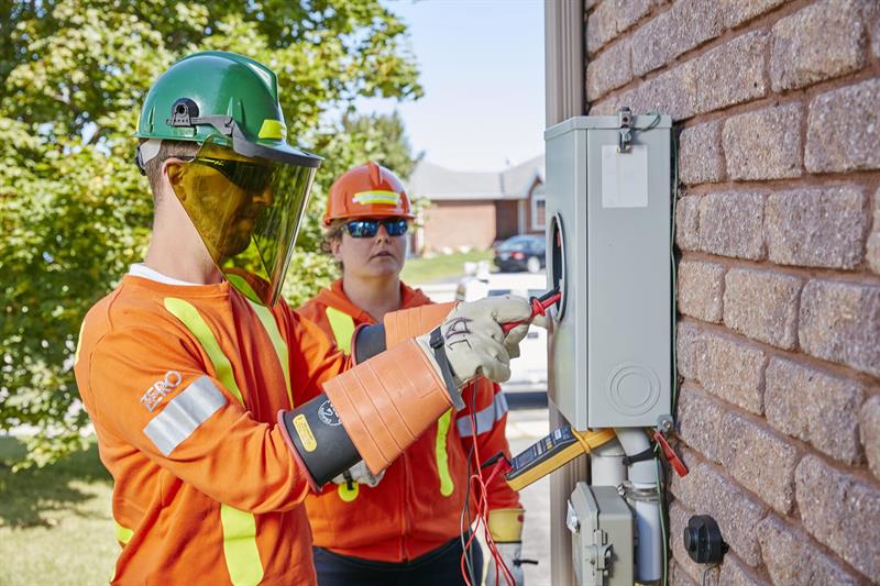 Field technicians inspecting a meter