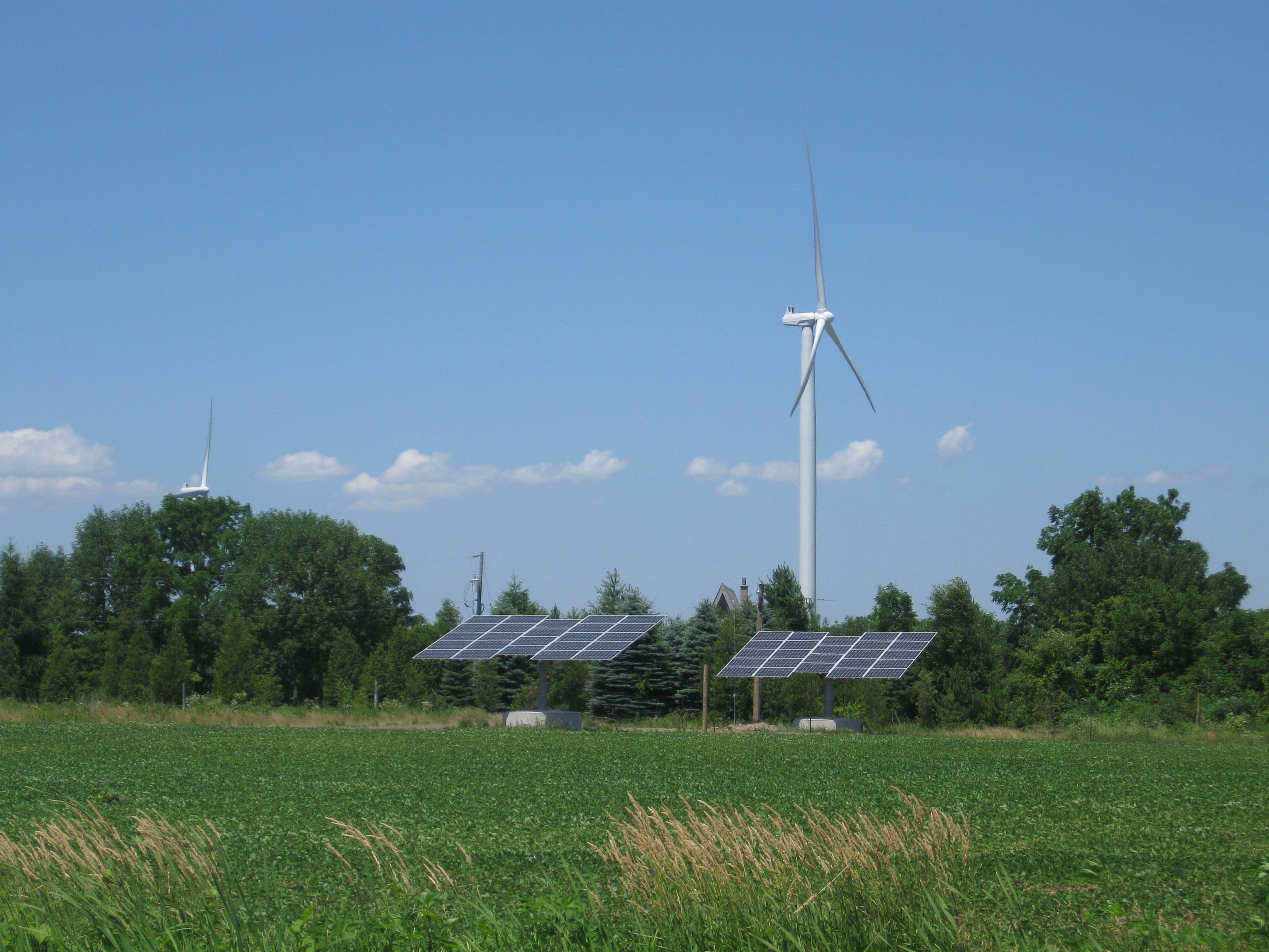 photo of a windmill and solar panels
