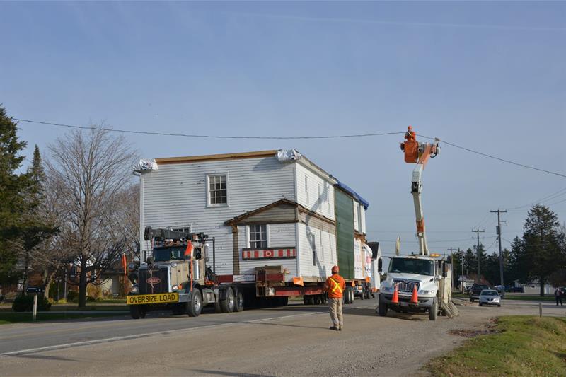 photo of a house being moved through city streets