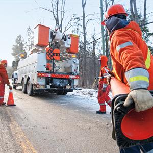 Image of a Hydro One crew responding to a power outage on a road