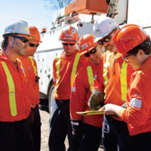 TEAMWORK: Valerie Lane conducts a tailboard meeting with her crew