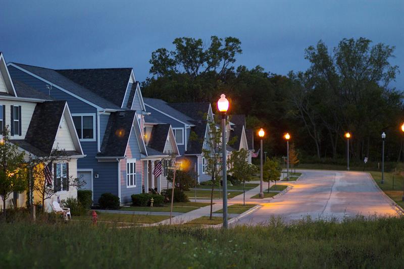 photo of a residential street at night