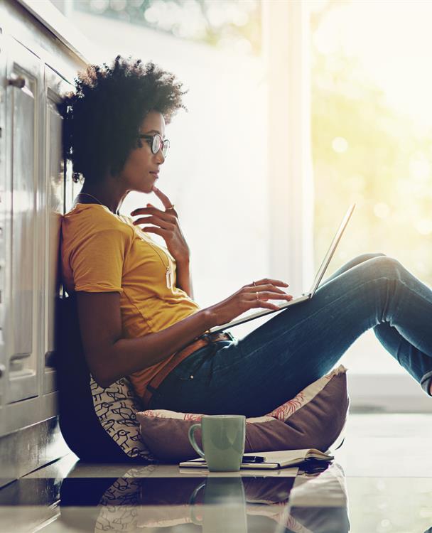 photo of a woman doing budgeting on her laptop