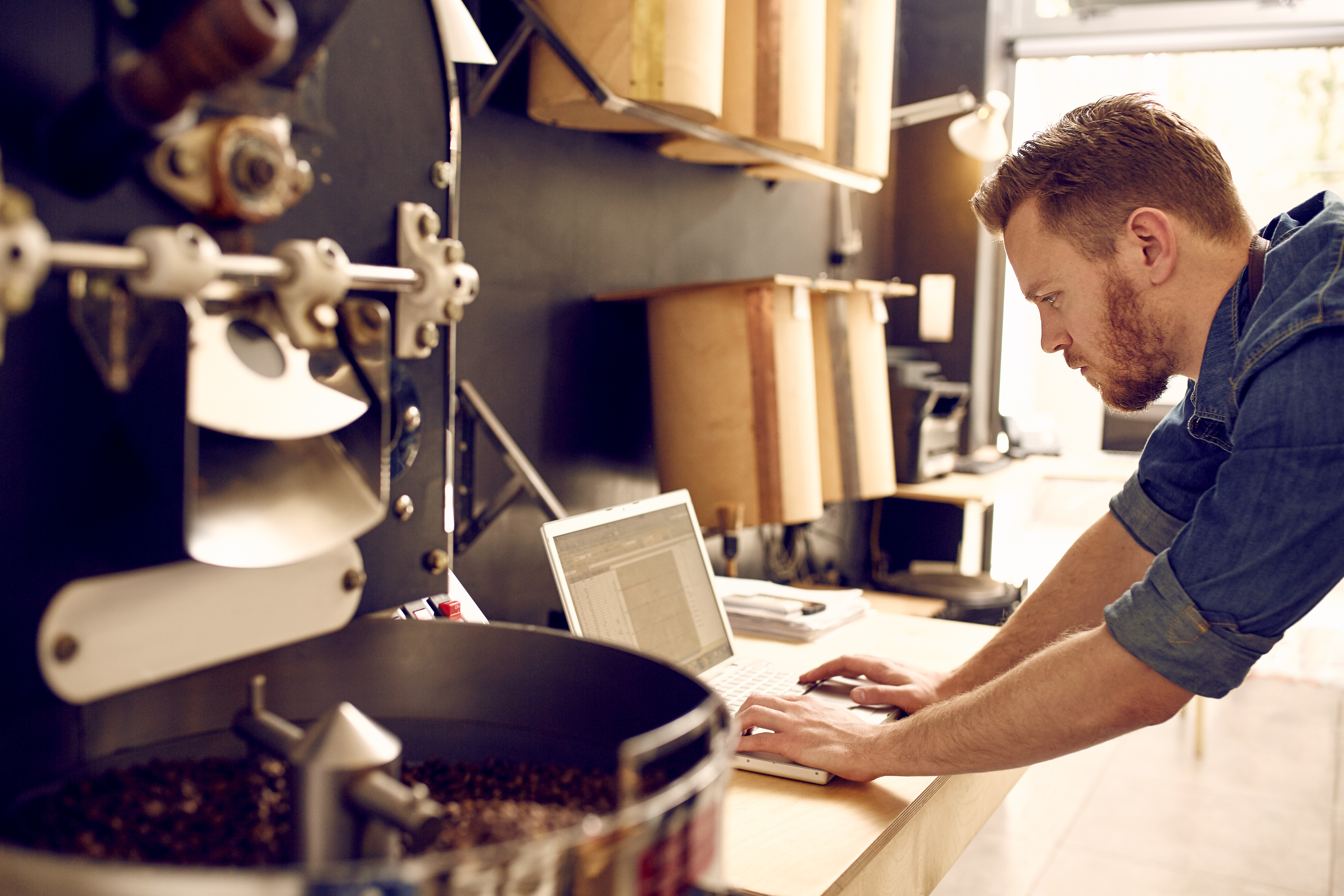 Photo of a person typing on a laptop computer
