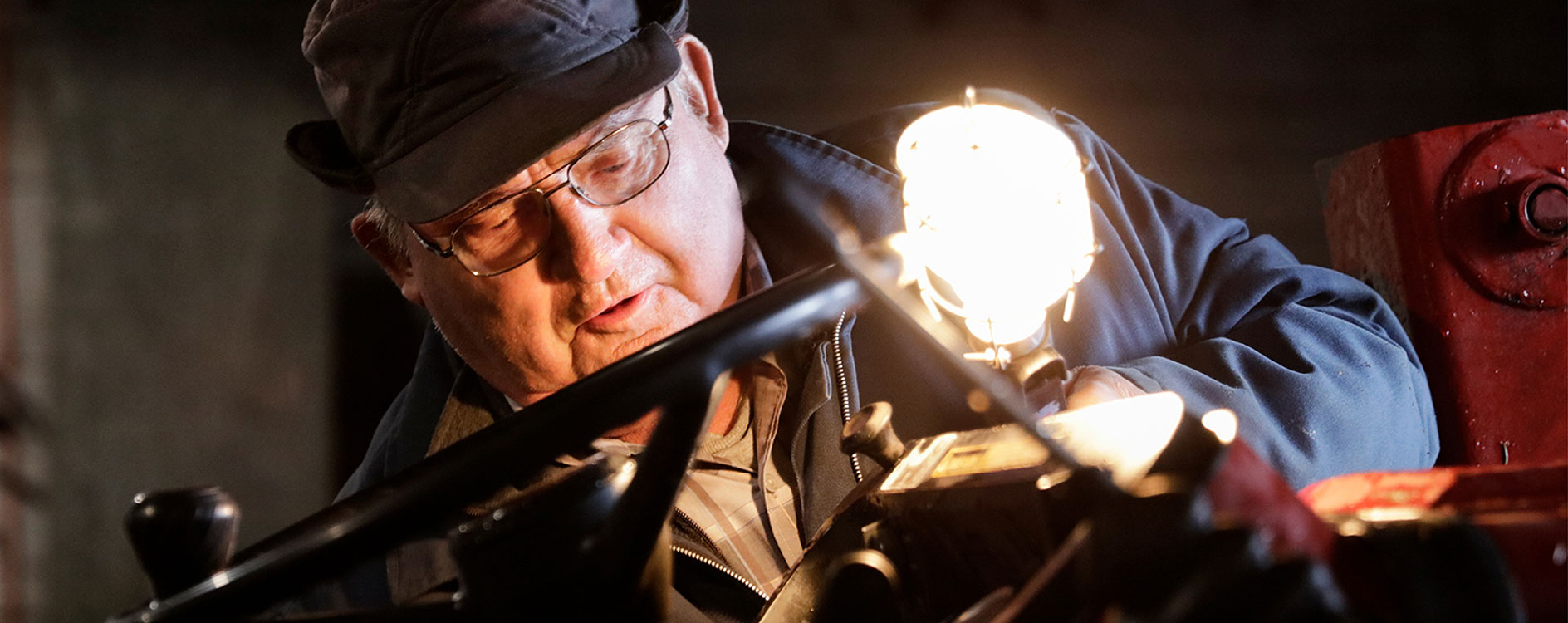 a man working in a factory wielding something