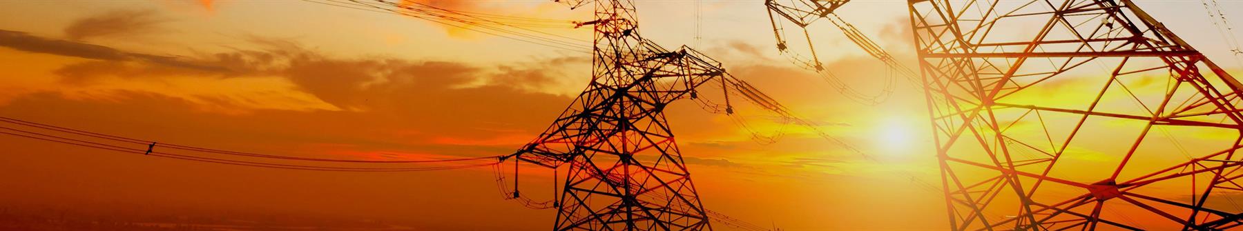 image: Transmission towers at sunset