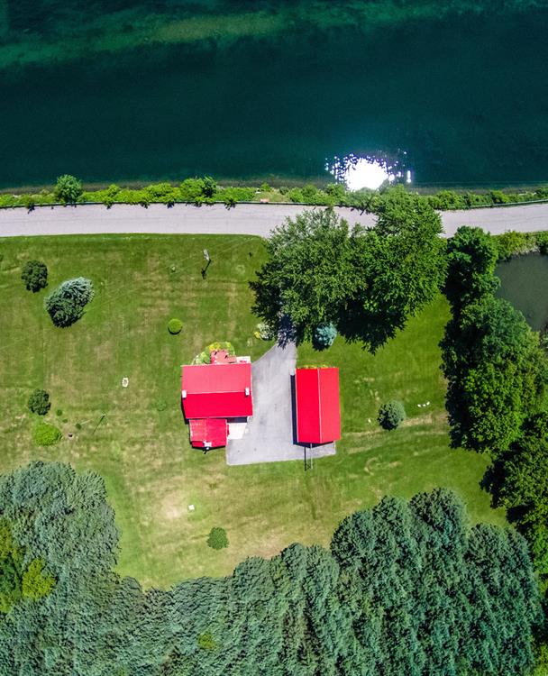 aerial photo of a large rural property lined with trees