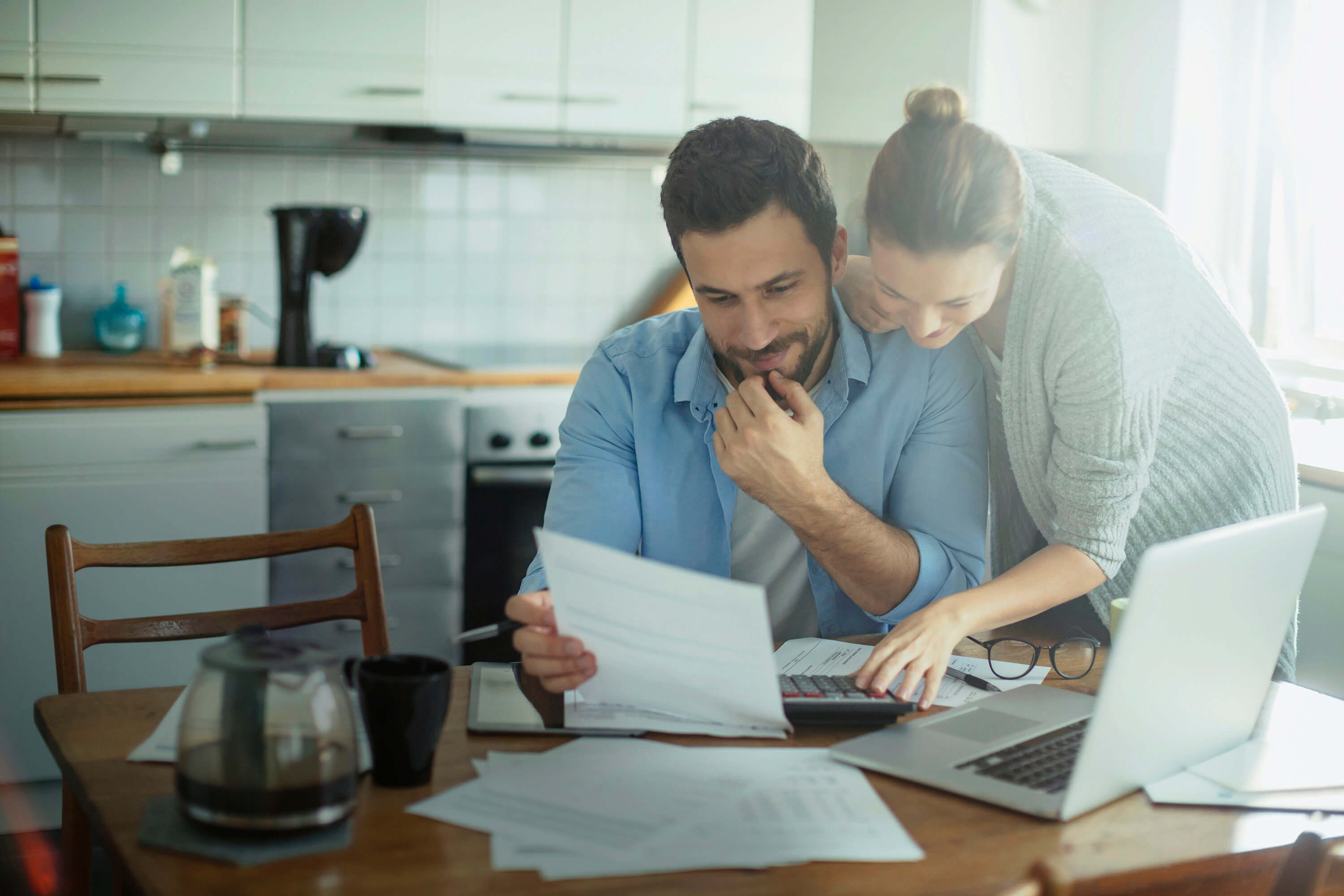 Photo of a couple looking at their bill