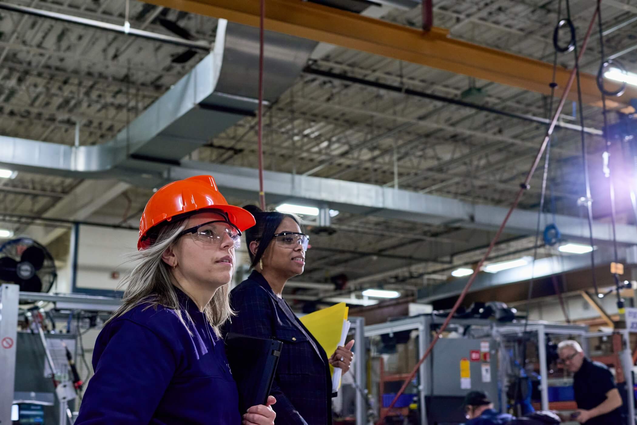 Two employees in a warehouse