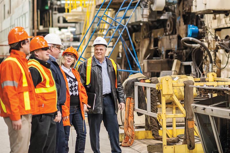 Photo of Hydro One representatives visiting an industrial business