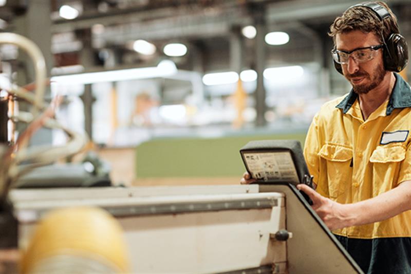 Photo of a man working at a factory