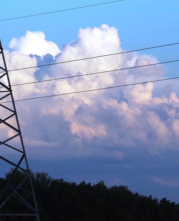 Photo of a transmission station with the sky in the background