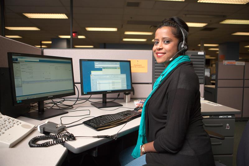 Woman using a computer in the call centre