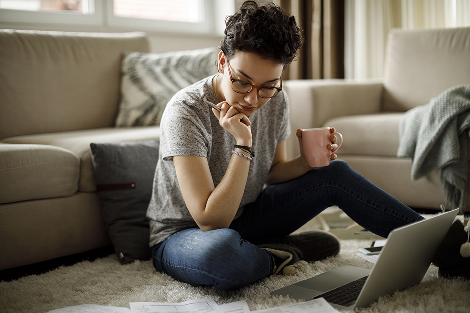 photo of a woman reading her electricity bill