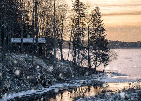 Lakeside cottage in a snow storm