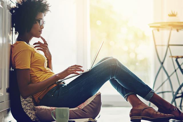photo of a woman using a laptop computer