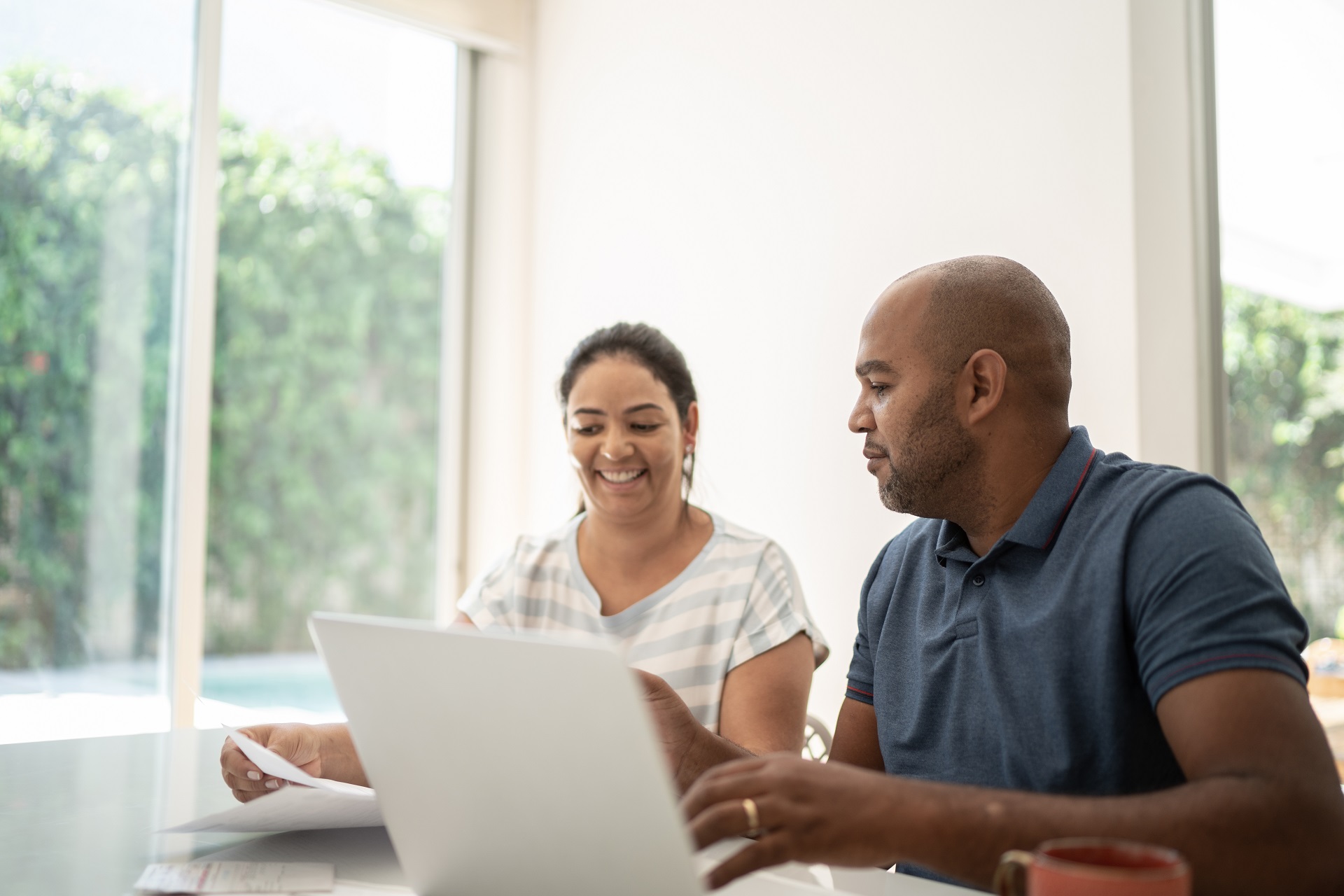 Couple looking on laptop