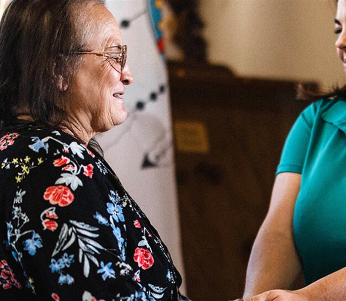 Photo of a Hydro One representative speaking to a customer from First Nations