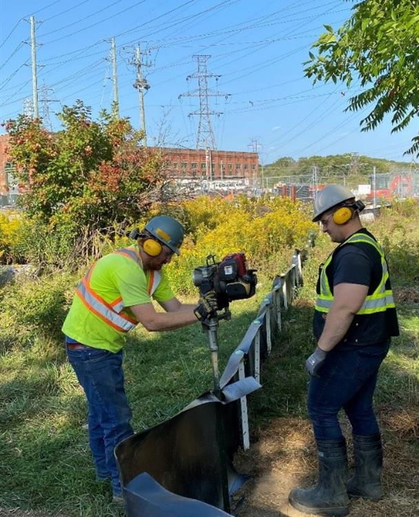 Photo: Hydro One workers installing a turtle fence at Cootes Paradise in Hamilton