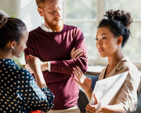 Two construction workers reviewing a blue print
