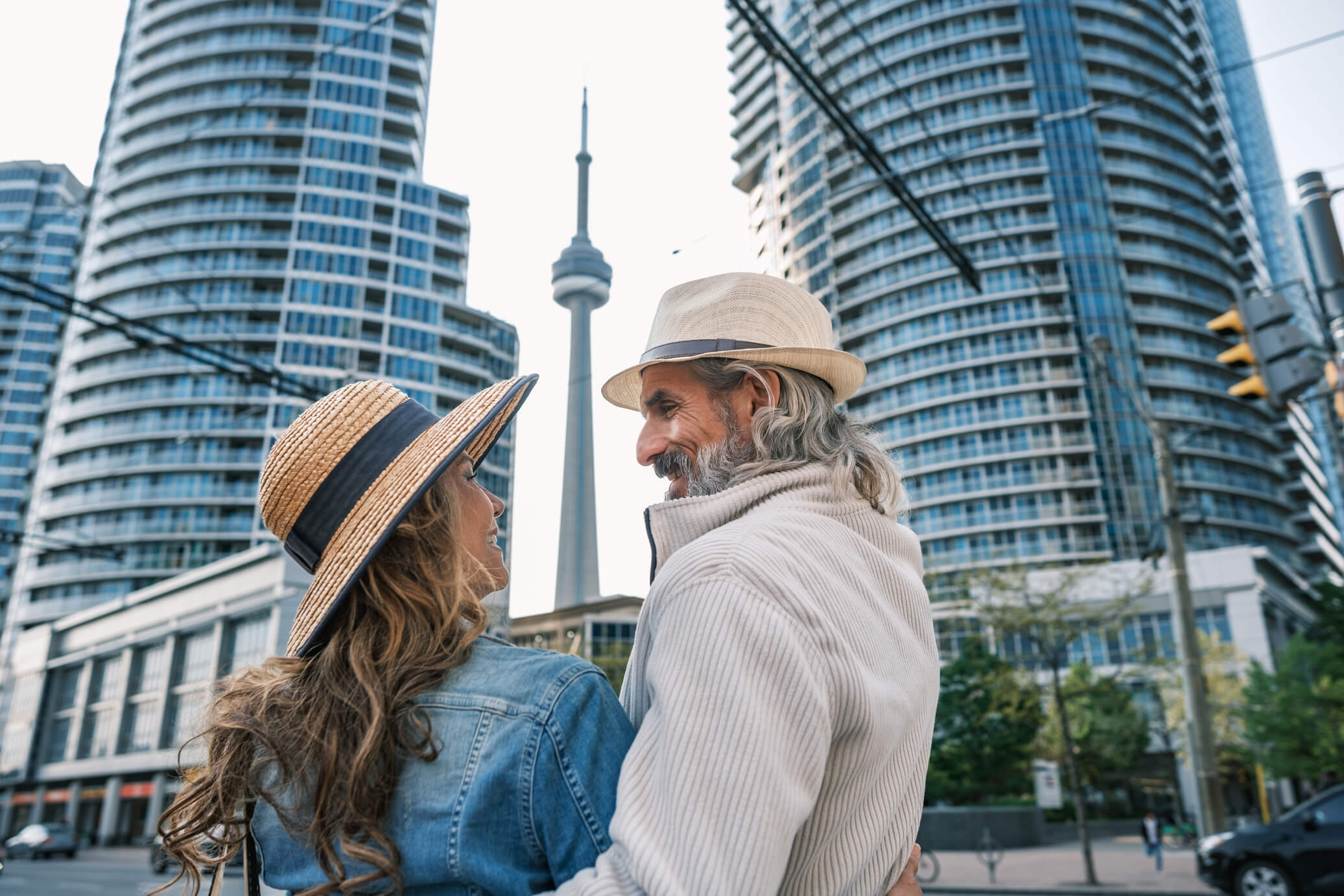 Couple looking at the CN Tower in downtown Toronto