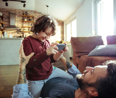 Parent and child laughing together