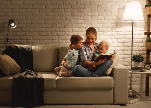 Mother reading to her two children