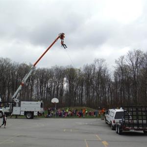 Image of Hydro One employees in a school field