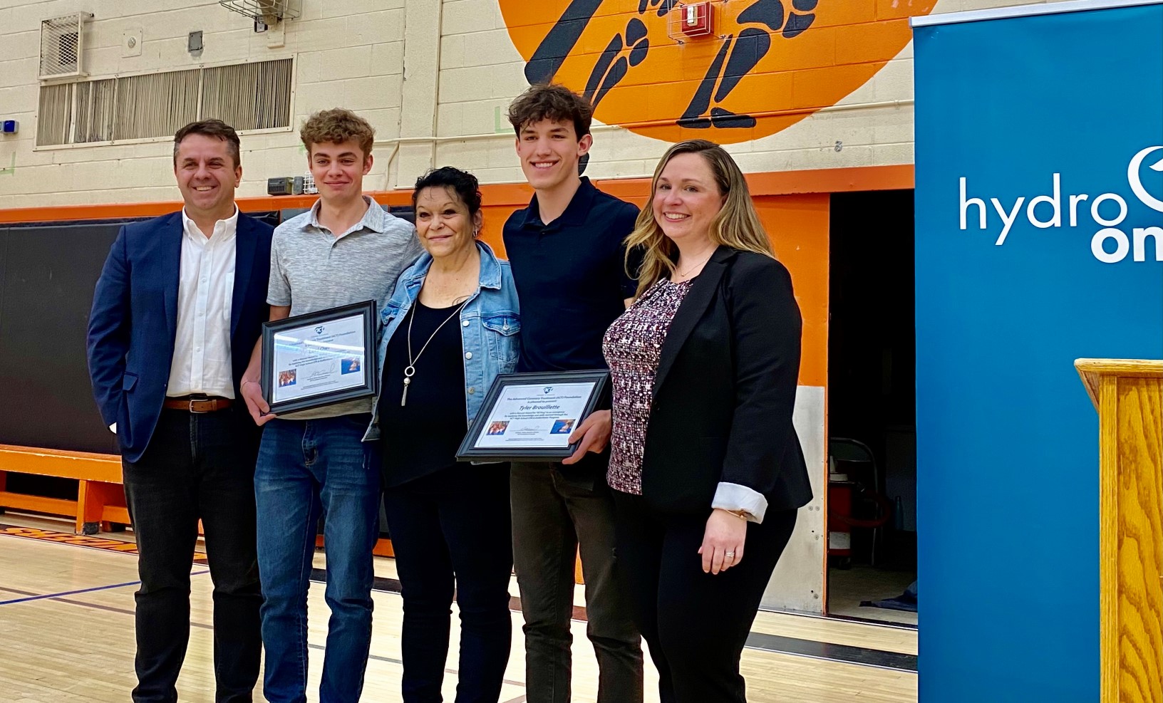 photo of teen heroes Tyler Brouillette and Levi Owl accepting their awards