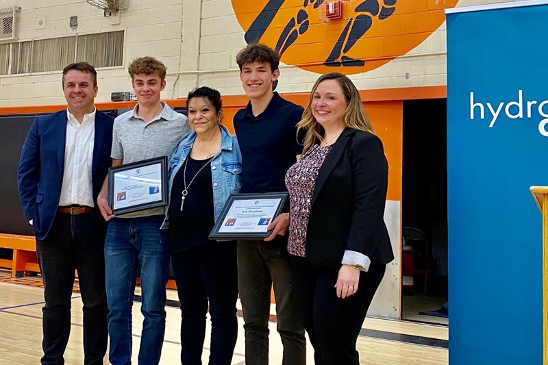 photo of teen heroes Tyler Brouillette and Levi Owl accepting their awards