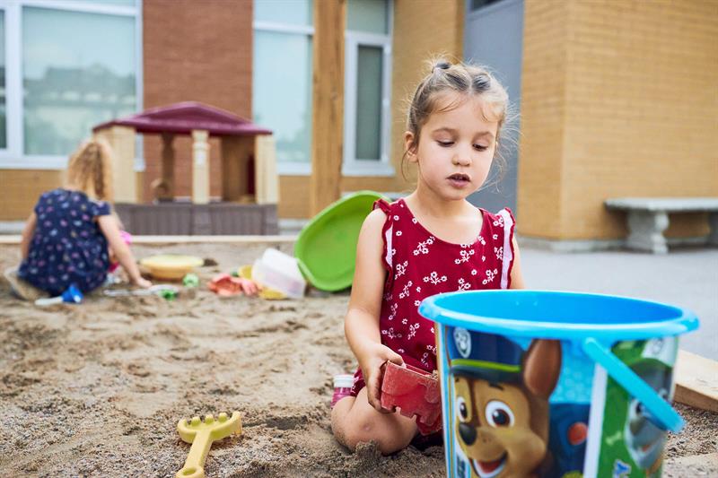Photo of children playing in a sandbox