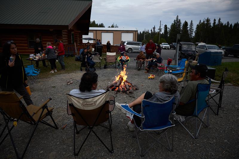 photo of Matachewan First Nations members around a fire