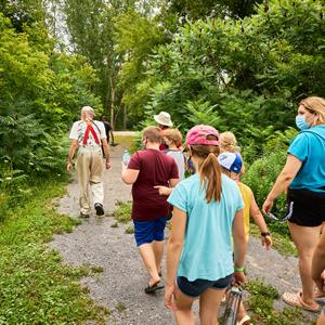 image of community walking through the new trail