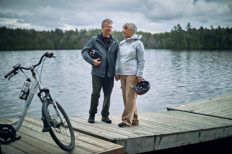 photo of two people standing on a dock in Muskoka