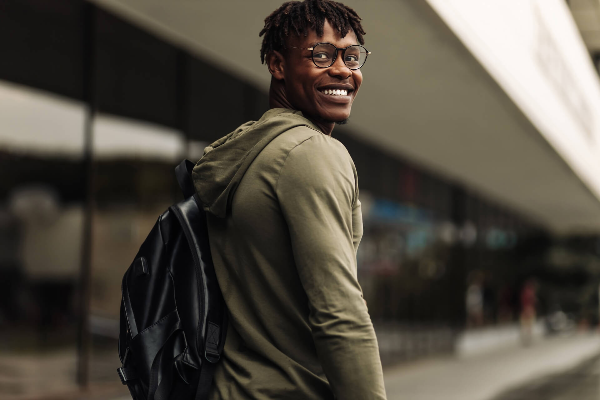 Student standing in a university hallway
