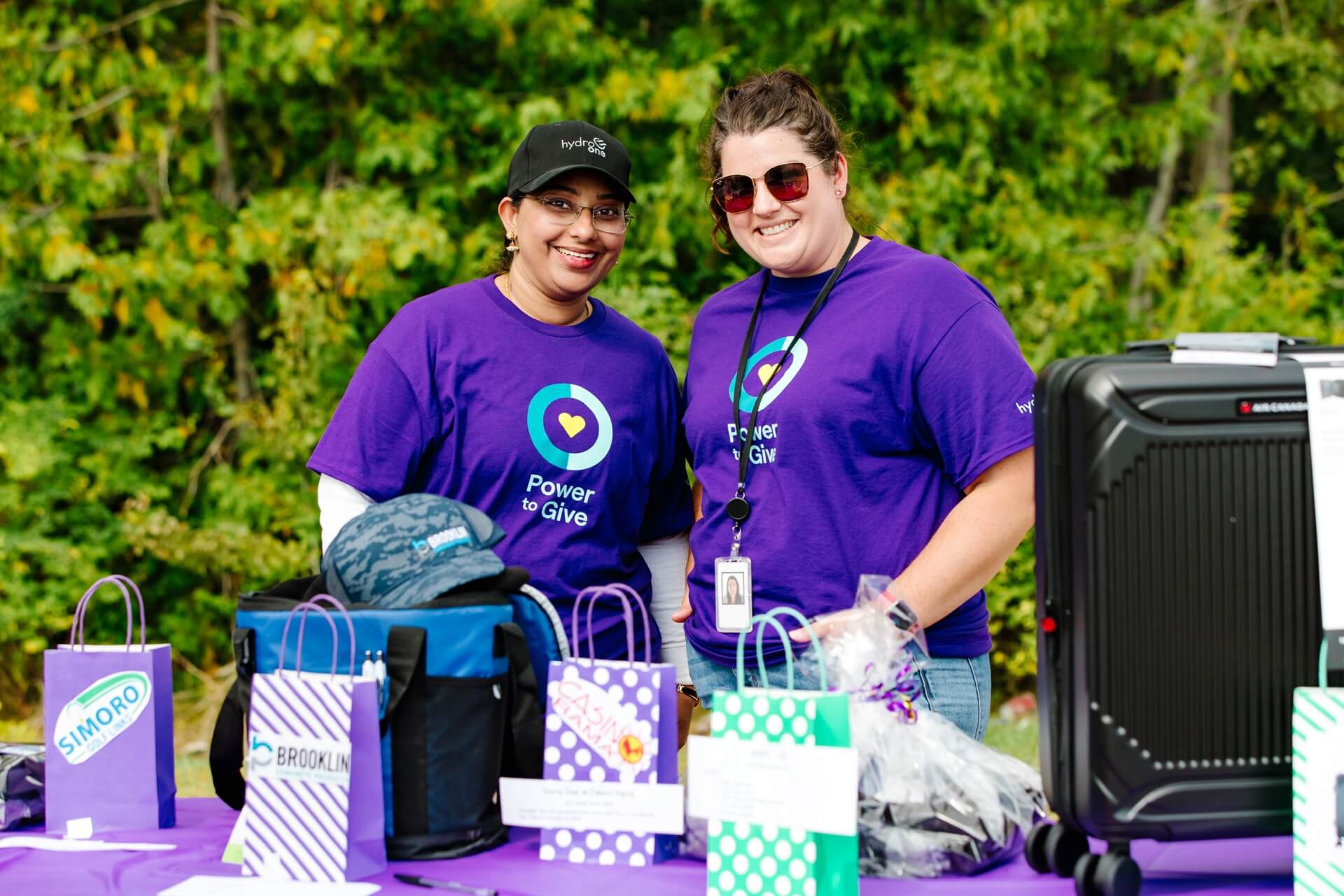 Two Hydro One employees at a donation charity event