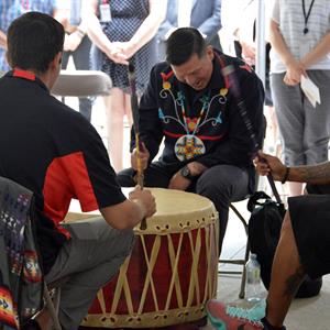Photo of Indigenous men playing drums