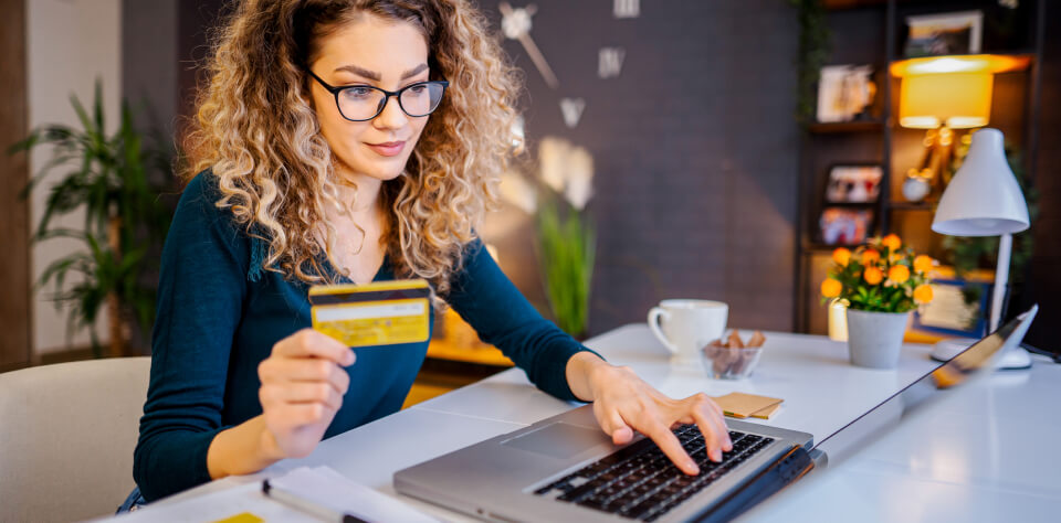 someone paying with their credit card at home