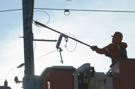 Hydro One worker fixing powerline