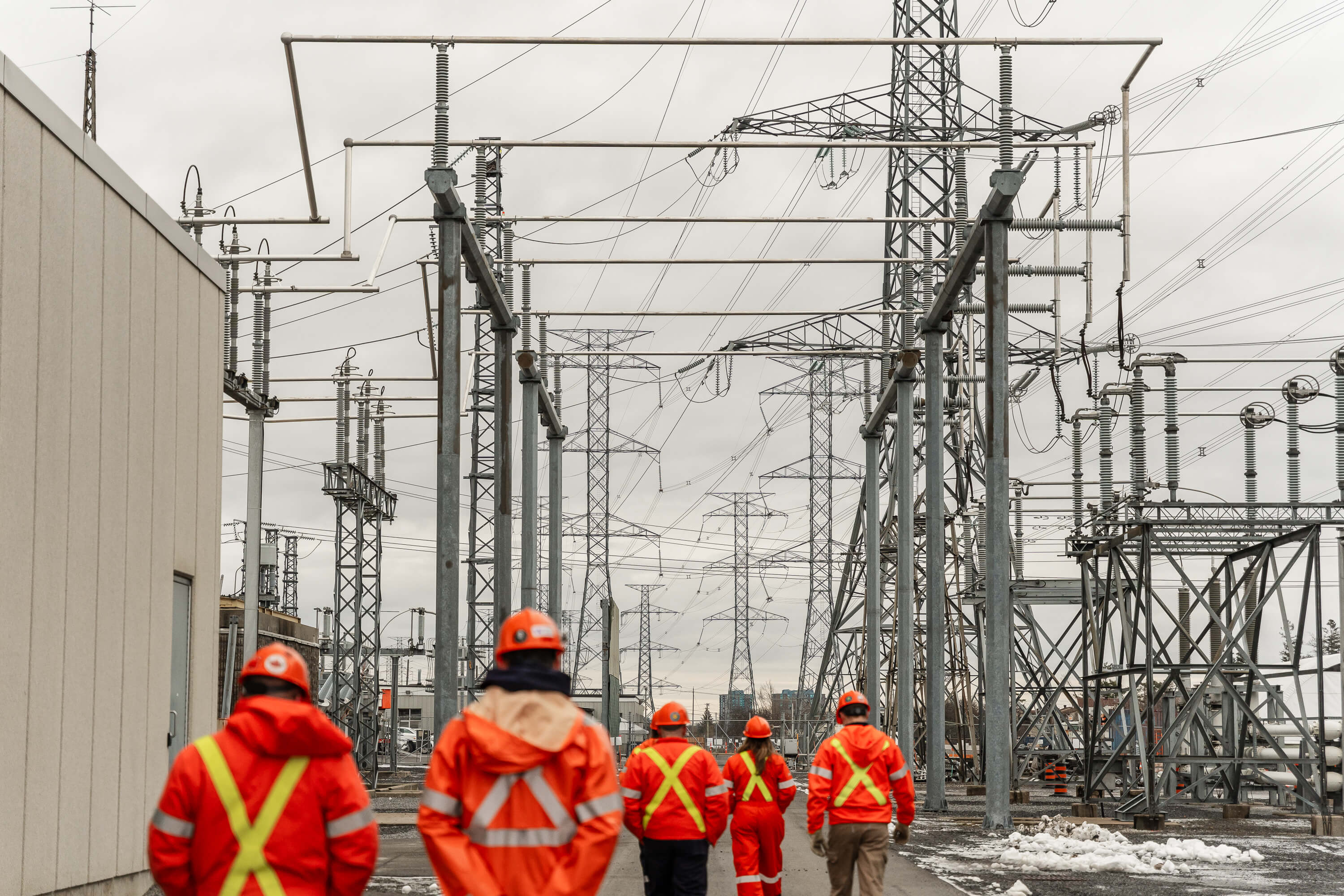photo of workers touring a Hydro One transformer station