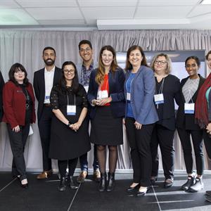 Photo of a diverse group of Hydro One employees at a conference