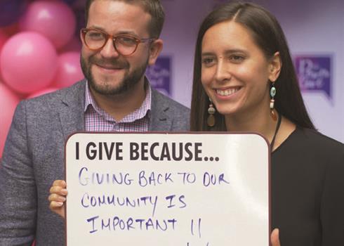 photo of Hydro One staff holding a sign supporting community