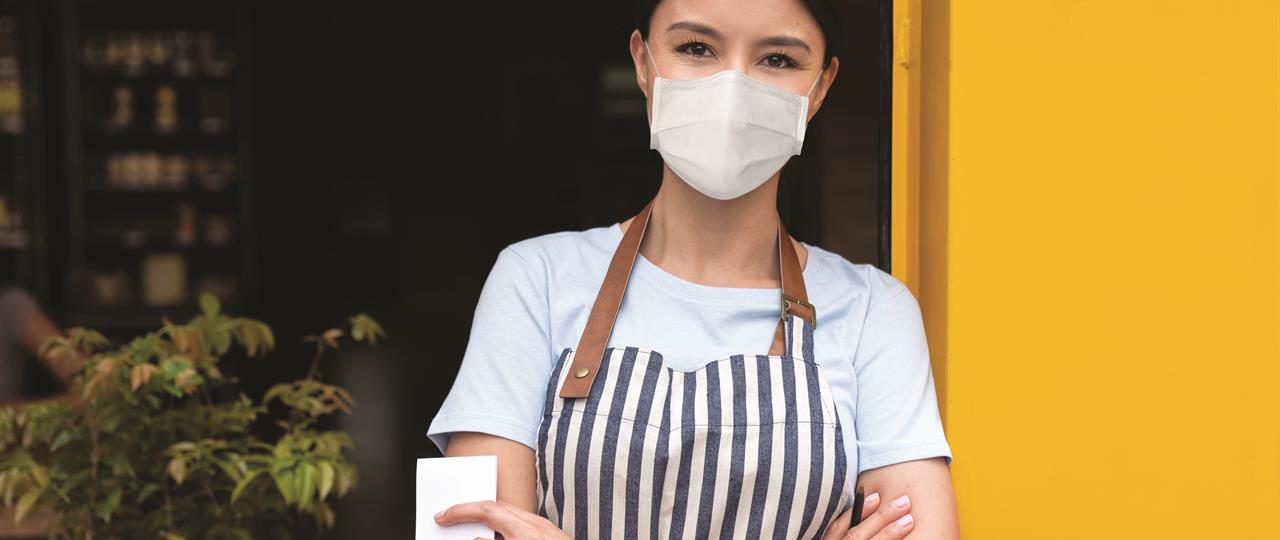 photo of a woman wearing a disposable mask