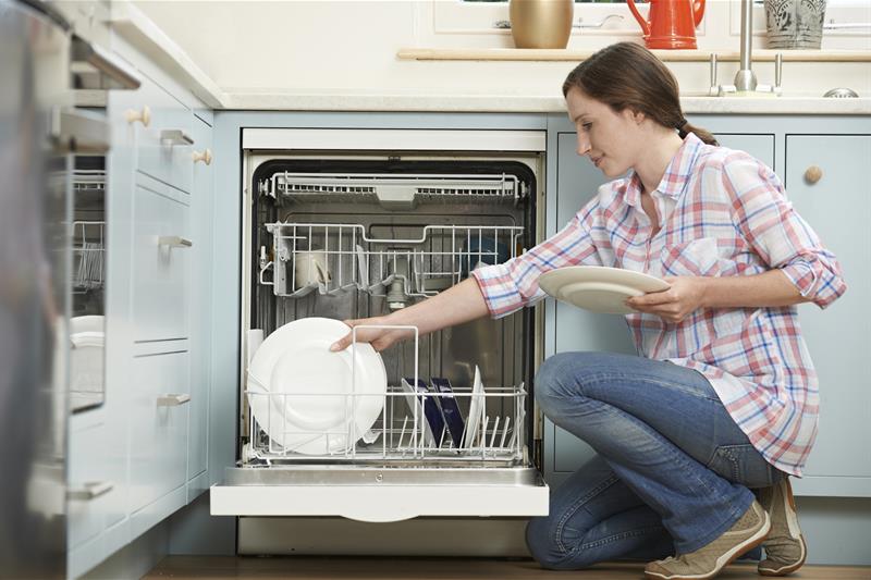 Picture of Woman loading Dishwasher