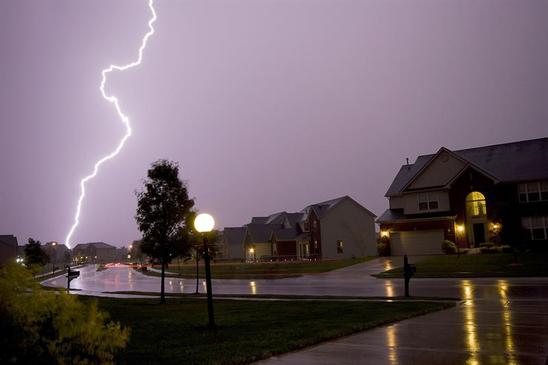 A lightning storm above a neighbourhood.